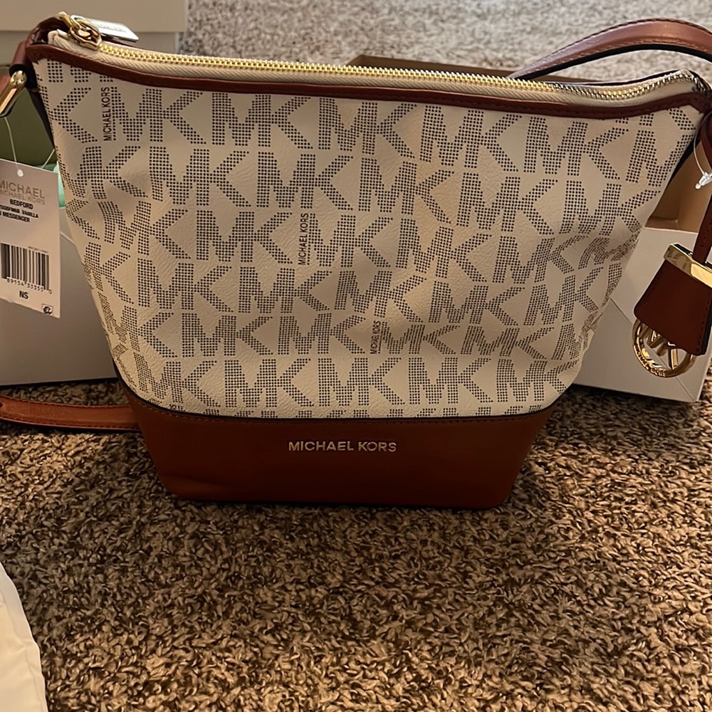 Michael Kors, purse Brand New with tags from Macy’s, comes with a duster bag